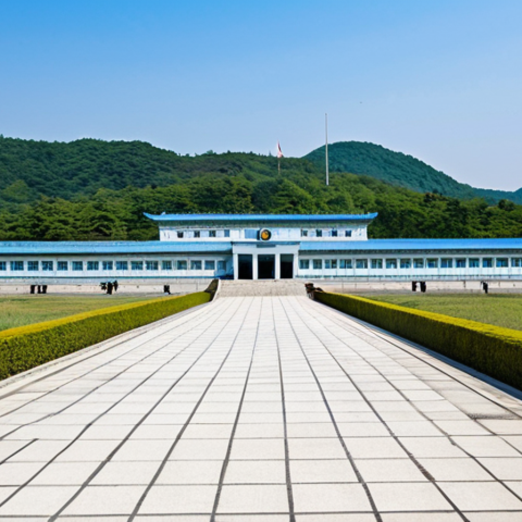 A professional, wide-angle photograph capturing the poignant atmosphere of the Demilitarized Zone (DMZ) at Panmunjom. The iconic blue United Nations buildings stand prominently, with a clear demarcation line visible on the ground. The scene conveys a sense of quiet observation and historical significance, with distant, modest structures on the horizon under a bright, clear sky. Fully clothed, appropriate attire, safe for work, appropriate content, professional, perfect anatomy, correct proportions, natural pose, well-formed hands, proper finger count, natural body proportions, high quality.